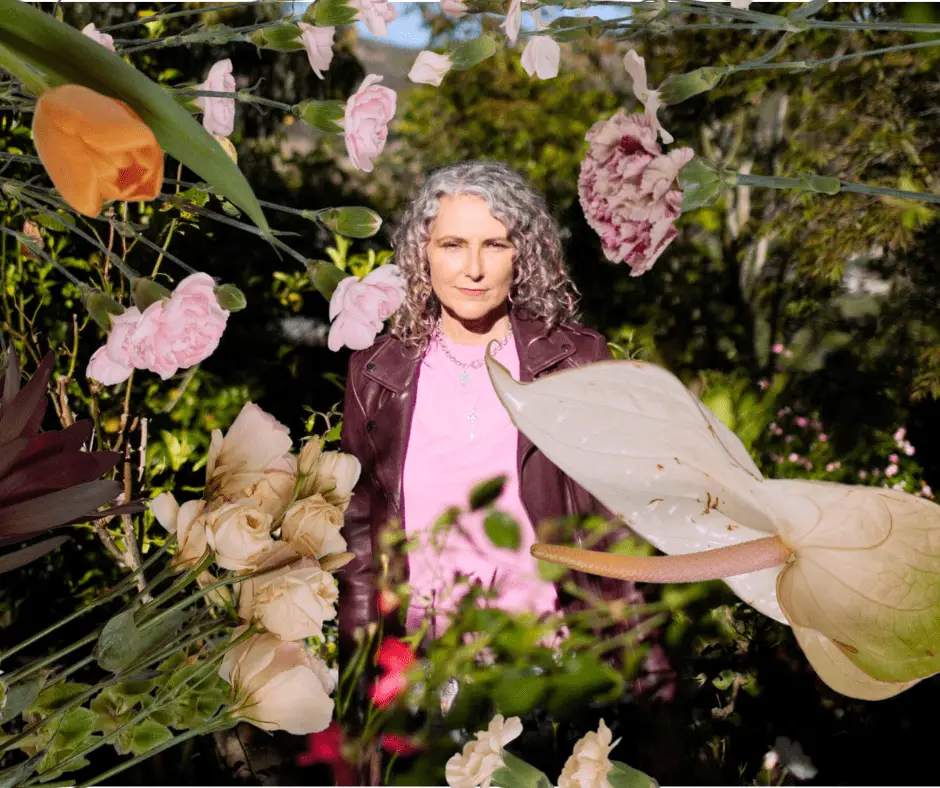 Jen Gunter in a beautiful field in Victoria with a floral overlay.