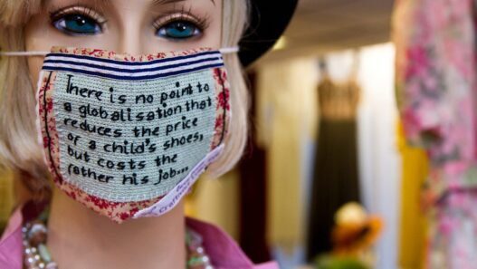 A Mannequin wearing a craftivist mask