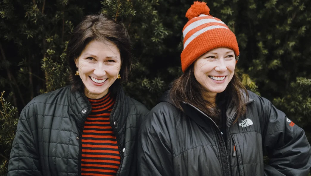 Kim and Kelley deal casually posing outside in winter garb.